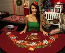 A dealer at a blackjack table at Casino.com.