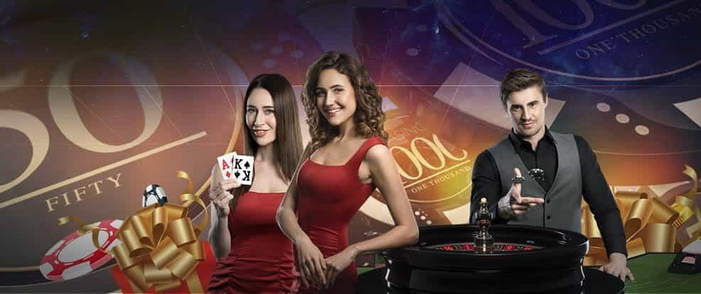 Live casino dealers at a roulette table.
