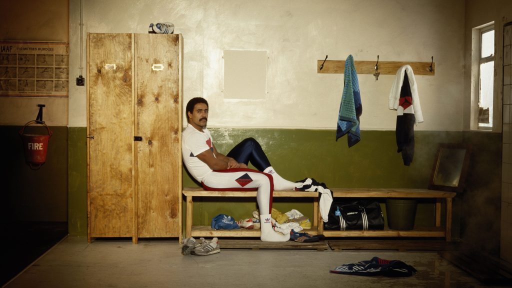 Daley Thompson is sitting alone in a changing room.