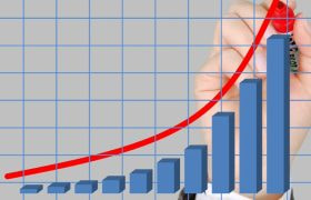 Hånd tegner voksende graf