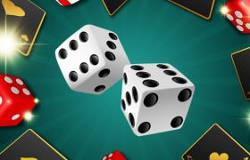 Dadi bianchi e rossi intorno a una carta nera