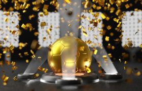 Gouden voetbal omgeven door gouden glitters