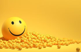 Grote smiley met heel veel kleine smileys (gele ballen)