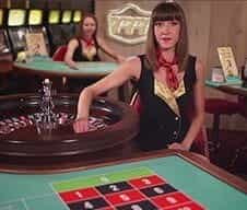 A 777 live casino dealer at the roulette table