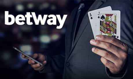 Betway logo and a man holding two cards