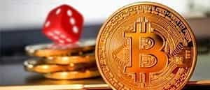 An image of a stack of coins with the Bitcoin logo.