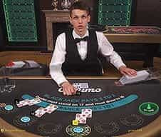 A Casumo live dealer at a game table.