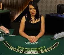A live croupier at Mansion Casino.
