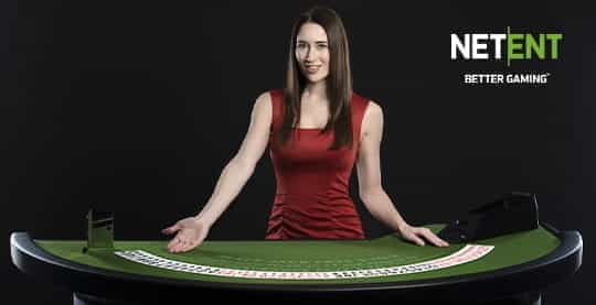 A smartly-dressed live dealer hosts a casino game from the NetEnt studio.