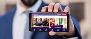 The PartyCasino app being played on a smartphone and tablet.