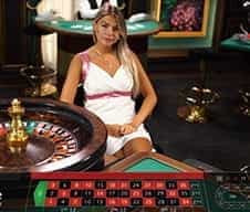 A live croupier at Roxy Palace.