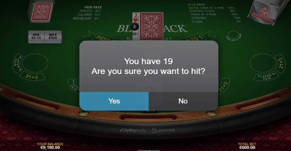 Premium Blackjack by Playtech gameplay showing a confirmation prompt before hitting.