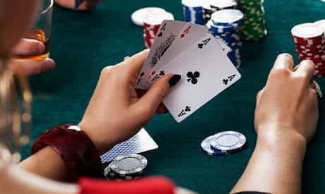 A player's hand holding three cards