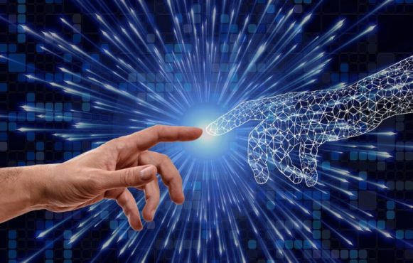 O mână umană și o mână digitală, realizată dintr-o rețea de fire luminoase