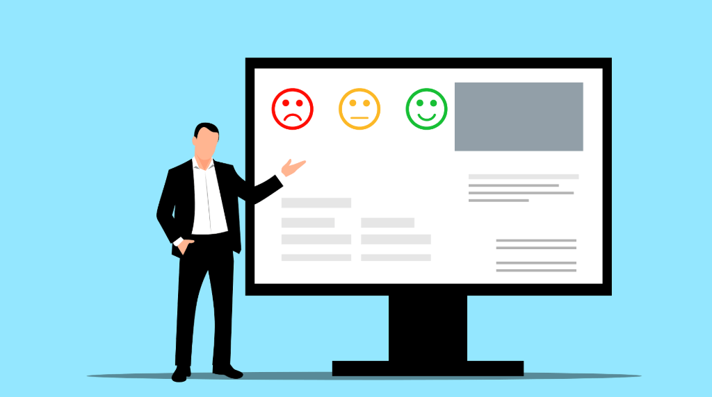 Bărbat în costum lângă un monitor care afișează trei fețe (tristă, neutră, fericită).