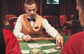 A croupier dealing cards in a casino.
