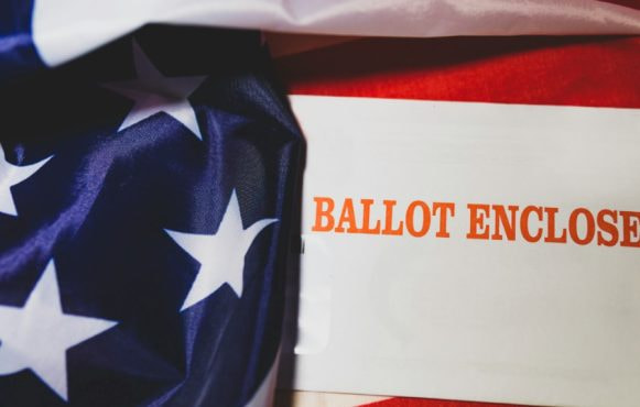 An enclosed ballot with the US flag