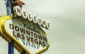 Welcome to Downtown Las Vegas sign against an overcast sky