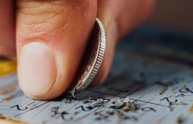 person-playing-scratch-card