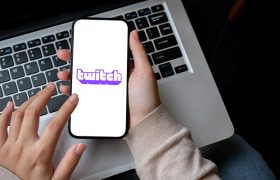 the-twitch-gambling-app-opened-on-a-phone-on-top-of-a-laptop