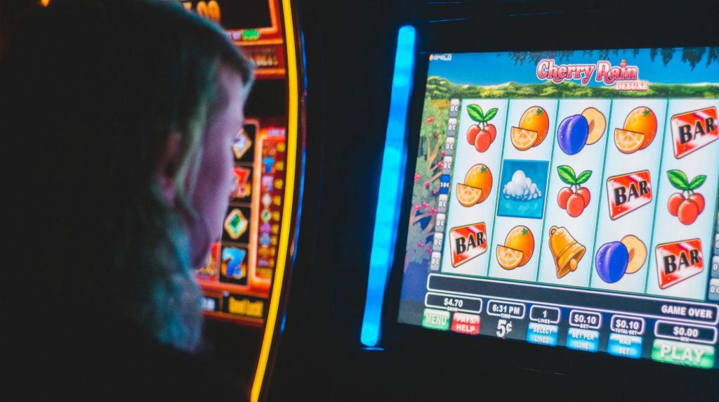 A person playing on a slot machine