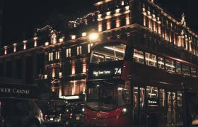 London's iconic double-decker bus in front of casino.