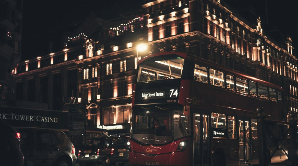London's iconic double-decker bus in front of casino.
