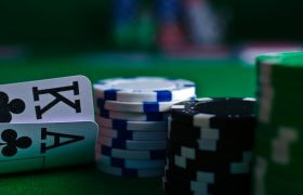 The player's Ace King behind a stack of checks.