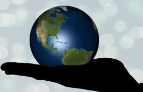 Hand Holding Globe with North America Showing