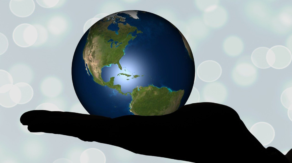 Hand Holding Globe with North America Showing
