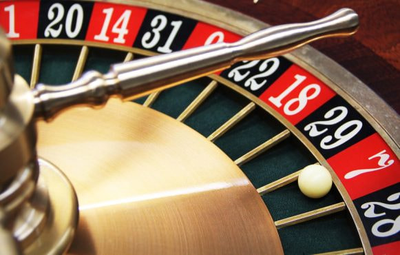 Roulette wheel with ball landing on seven