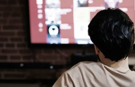 Fans watching a sporting event on TV