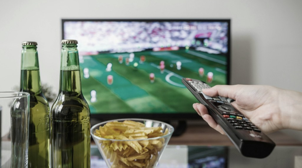 Remote control held in a hand