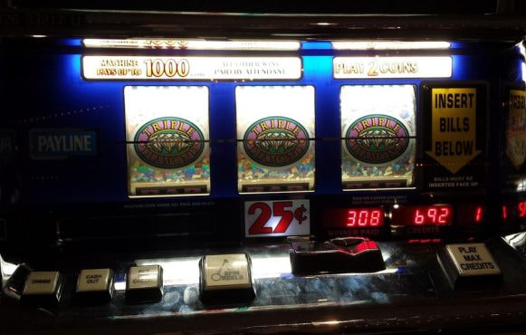 Slot machine with jackpot showing on reels.