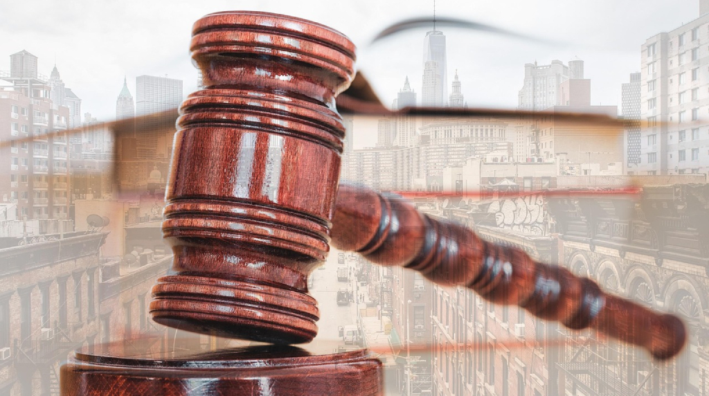 Judge's gavel against a city skyline