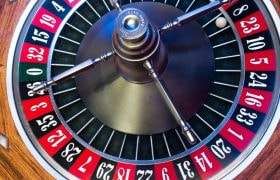 A picture of a roulette wheel in a caisno