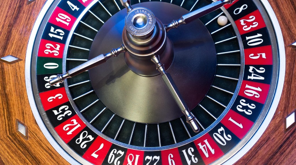 A picture of a roulette wheel in a caisno