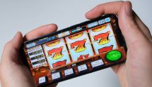 Person playing slots on mobile.