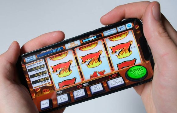 Person playing slots on mobile.