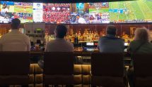 People in a bar watching sports