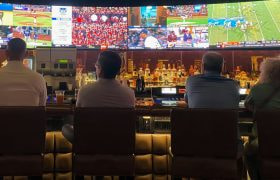 People in a bar watching sports