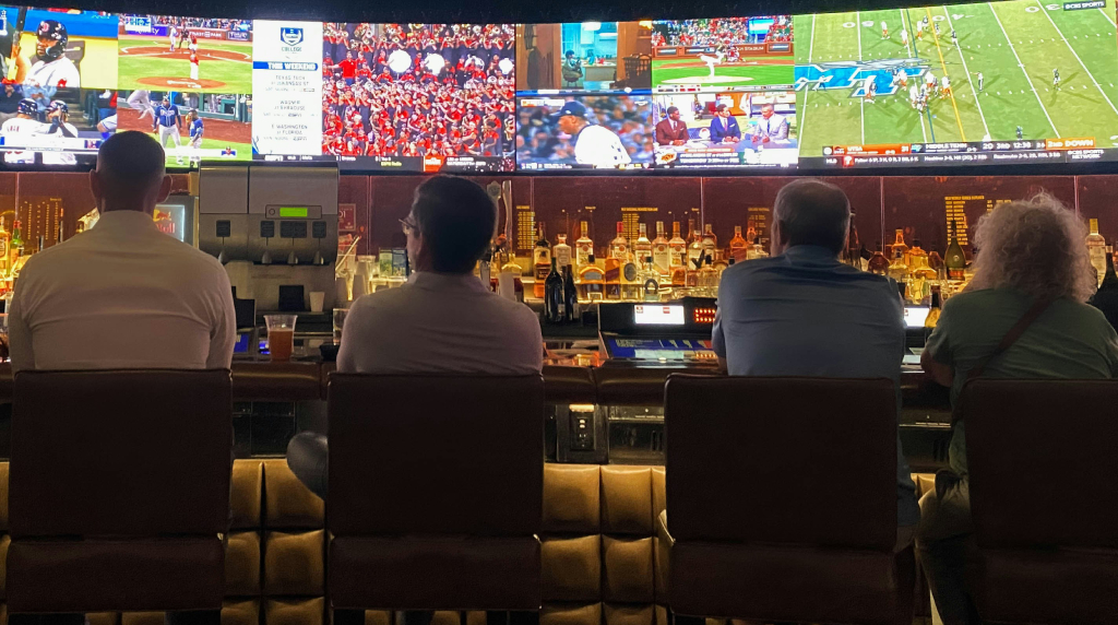 People in a bar watching sports