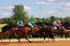 A stock image of some horses racing