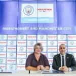 Damian Willoughby and , Natalia Zavodnik signing an agreement between Marathonbet and Manchester CIty.