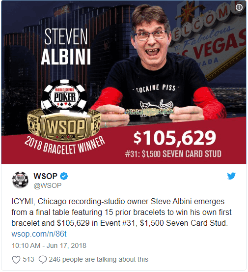 Steve Albini holds up World Series of Poker gold bracelet.