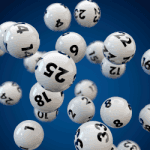 Numbered lottery balls hang in the air.