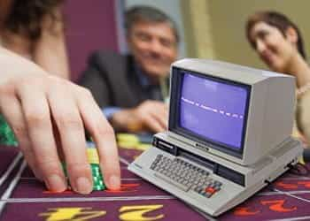 A computer at a poker table.