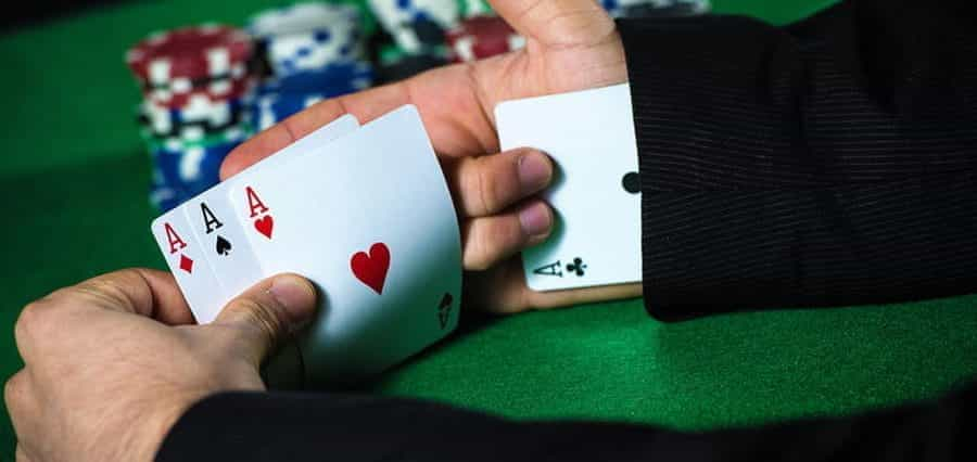 A playing card up a sleeve.