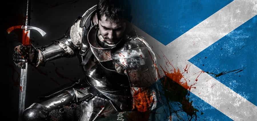 A soldier in front of the Scottish flag.