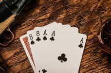 A "Dead Man's Hand" in poker on a table.